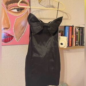 Strapless black mini bow dress with bedazzling outline around the bow ! Size 4